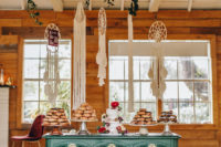13 The wedding dessert bar was done with a green table and vegan desserts plus dream catchers over it