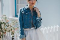 13 a casual yet edgy bridal look with a plain maxi skirt, a grey top, a denim jacket and a cage veil