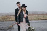 16 a naked lace wedding dress, a black leather jacket, black boots and a black hat