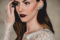 21 a gorgeous makeup with a dark lip, a rhinestone cuff and black nails make the bridal look super edgy