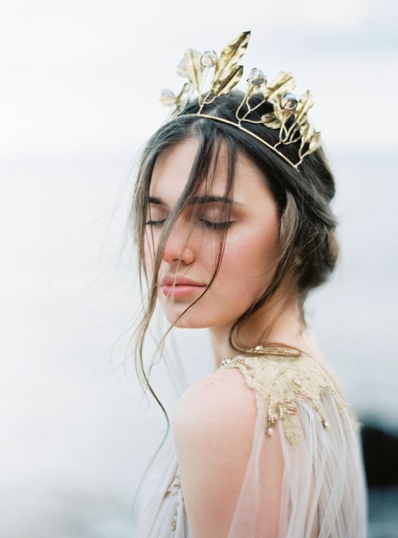 a unique gold leaf bridal crown and a wedding dress with matching gold embroidered leaves for a chic look