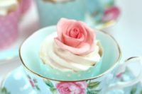 28 cupcakes served in vintage teacups is a very creative and chic idea for a vintage wedding