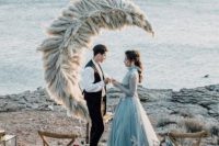 a unique half moon wedding altar made of pampas grass is a very creative piece for your ceremony