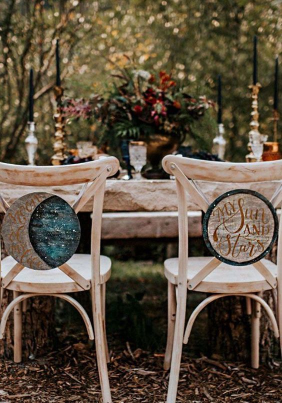 celestial wedding signs on the chairs will be a nice altarnative to usual wedding chair signage