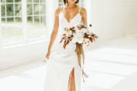 03 The bride was wearing a sleek minimalist wedding dress, bold printed shoes, statement earrings and a sleek bob