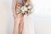 03 a blush suit, a white shirt, a colorful floral print tie and tan shoes for a chic spring groom’s outfit