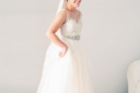 04 The bride was wearing a wedding separate of a lace top and a layered tulle skirt plus an embellished sash