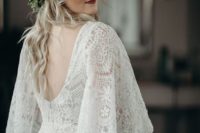 04 a boho lace sheath wedding dress with bell sleeves and a cutout back with a greenery crown are a gorgeous idea for a boho bride