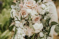 05 The wedding bouquet was lush and neutral, with blush and white blooms and cascading greenery
