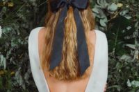 05 thick black ribbon adds such a stylish touch to this classic half-up, half-down hairstyle