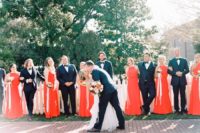06 The groom and groomsmen were rocking navy tuxedos and the bridesmaids were rocking sleeveless red maxi dresses