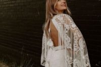 07 a boho lace wedding gown with wide bell sleeves, a cutout back and tassels on long ties for a glam boho bride
