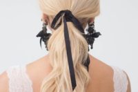 07 a wavy ponytail with a black ribbon and matching black lace and ribbon earrings by Marchesa