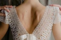 08 a boho wedding dress with a boho lace bodice and a cutout back on a bow plus a flowy plain skirt for a romantic bride