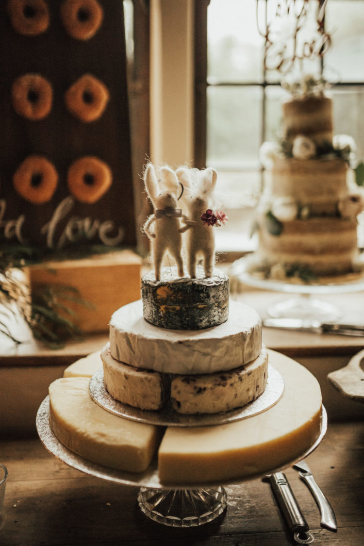 A usual wedding cake was substituted with a cheese tower and funny mice toppers
