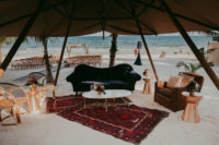 09 The beach lounge was done with rattan chairs, a leather one, a velvet sofa placed right on the sand