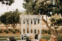 10 The wedding lounge was done with jute rugs and ottomans, a macrame backdrop plus chairs