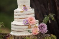 13 The wedding cake was naked and topped with large colorful fresh blooms
