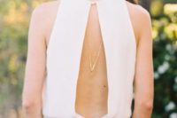14 a minimalist sleeveless wedding dress with a cutout back and a necklace to highlight it is a cool and bold idea