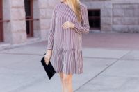 15 a striped burgundy and white drop waist over th eknee dress, black strappy shoes and a black velvet clutch for a fall wedding