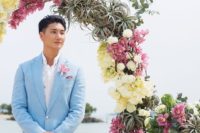 17 a serenity blue wedding suit with a white shirt and a pink floral boutonniere for a cool tropical groom’s look