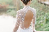 17 a very romantic A-line wedding dress with a sheer lace bodice and cutout back plus a full skirt and matching floral hairpieces