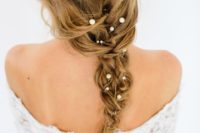 18 a messy bridal braid spruced up with pearl pins is a very chic and romantic idea