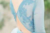 19 an icy blue wedding dress with an illusion lace top with back cutouts and a flowy skirt for a non-traditional look