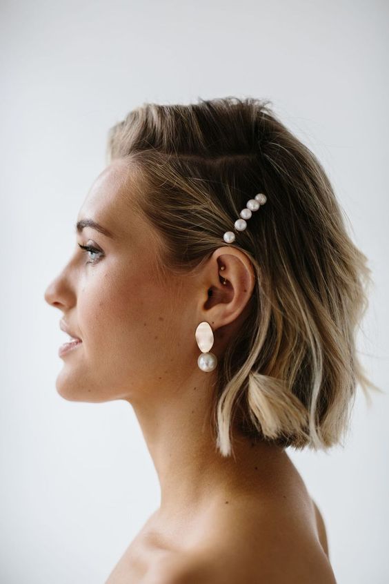 pearl pins and matching statement earrings will accessorize your coastal or beach bridal look