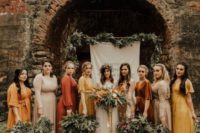 22 mismatching bridesmaid dresses in various colors and with long and short sleeves for a boho wedding