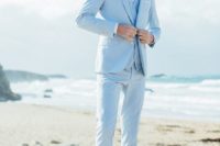 23 a light blue three-piece suit, a white shirt, a neck tie, brown shoes and a man bun for a coastal groom’s look