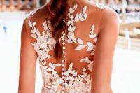 23 a sleeveless sheath wedding dress with a white floral and botanical applique back and a row of buttons