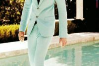 25 a mint green suit with a white shirt and a black tie and retro-inspired black and white moccasins for a spring groom