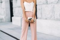 25 pink wideleg pants, a creamy spaghetti strap top, statement earrings, a small clutch with appliques for a casual summer wedding