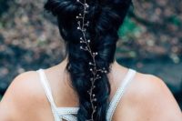 26 a twisted braid with a crystal hair piece is a unique and creative idea
