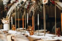 Tables were decorated by white and brown long candles, a lot of flowers and a macrame