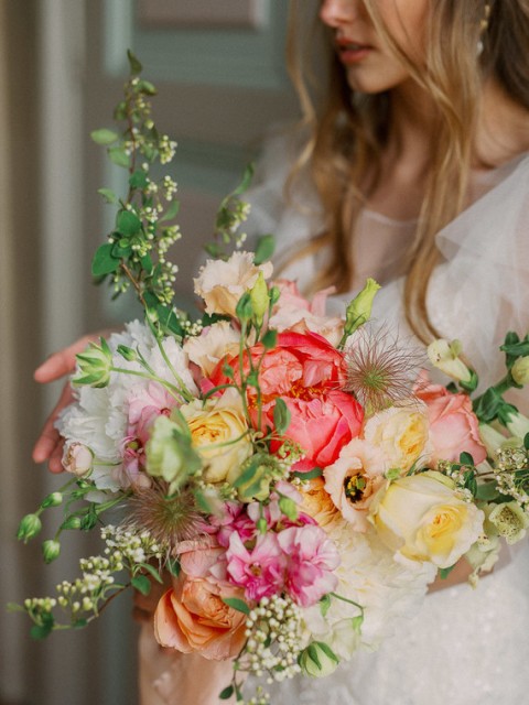 The bridal bouquet consisted of English garden roses, ranunculus and greenery