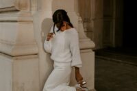 a casual bridal look with a white fuzzy sweater and a maxi skirt wiht a train plus silver shoes is all cool
