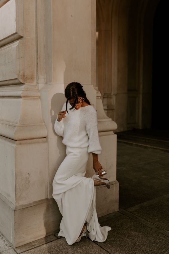 a casual bridal look with a white fuzzy sweater and a maxi skirt wiht a train plus silver shoes is all cool