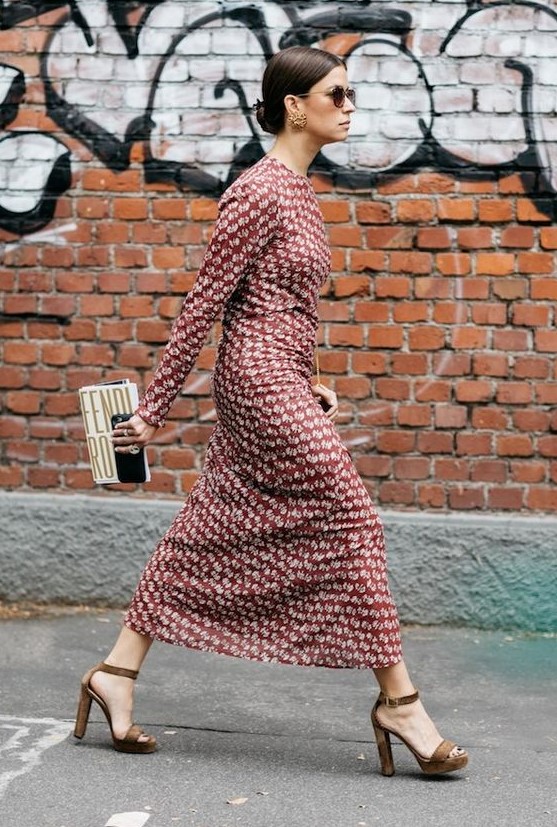 a chic burgundy printed midi dress with long sleeves, a high neckline, brown platform shoes and a whimsy clutch
