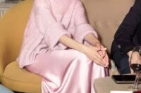 a feminine and tender outfit idea with a pink silk dress, an oversized turtleneck sweater and fuchsia high heels