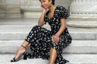 a gorgeous black and white floral midi dress with a square neckline and puff sleeves, black heels and statement jewelry