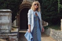 a lovely wedding guest look with a blue midi slip dress, a white blazer, red mules and a blue clutch for spring