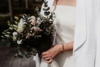 a minimalist creamy off the shoulder mini dress, a white blazer, a birdcage veil is a lovely idea for a modern Parisian wedding