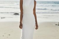 a minimalist white sheath dress with a high neckline and no sleeves is an ultimate idea for a modern bride