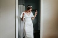a modern and casual midi wedding dress with a V-neckline and short sleeves is a cool and stylish solution