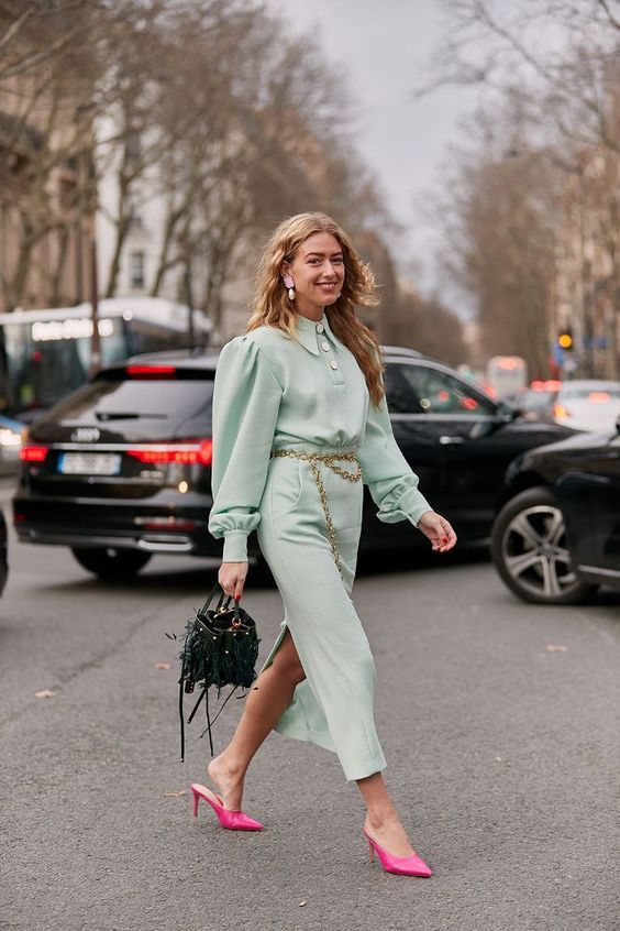 A pretty mint colored midi shirtdress, hot pink heeled mules, a catchy dark green bag and a gold chain belt