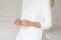 a very cool and simple plain mini wedding dress with a high neckline and short sleeves plus a ruffle edge is a stylish casual idea