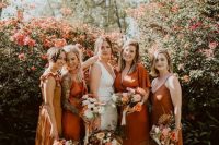 beautiful mismatching bridesmaid dresses – a yellow, orange ones and a rust one, midi and maxi for a trendy modern wedding