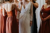 beautiful mismatching rust midi bridesmaid dresses with various necklines and looks plus mismatching heels for a trendy wedding
